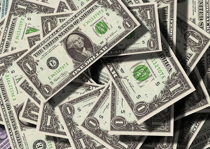 Dollar gains as investors brace for higher rates