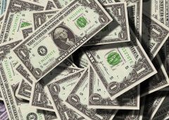 Dollar gains as investors brace for higher rates